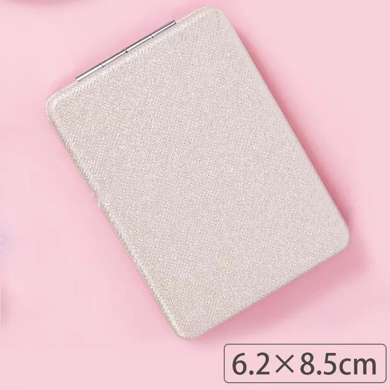 Zonyin Cute Portable Round PU Leather Folding Mirror Shiny Heart Shape 2X Double Sided Pu Pocket Makeup Mirror with Custom Logo