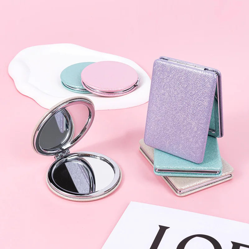 Zonyin Cute Portable Round PU Leather Folding Mirror Shiny Heart Shape 2X Double Sided Pu Pocket Makeup Mirror with Custom Logo