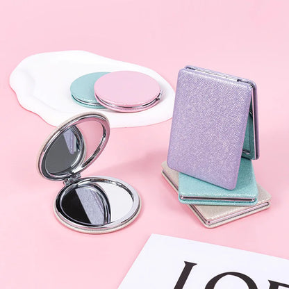 Zonyin Cute Portable Round PU Leather Folding Mirror Shiny Heart Shape 2X Double Sided Pu Pocket Makeup Mirror with Custom Logo