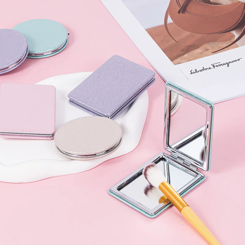 Zonyin Cute Portable Round PU Leather Folding Mirror Shiny Heart Shape 2X Double Sided Pu Pocket Makeup Mirror with Custom Logo