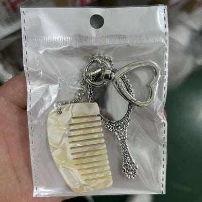 Zonyin Wholesale Mini Handle Handheld Makeup Mirror Keychain with Pendant Comb Mobile Phone Hanging Bag Decorative Accessories
