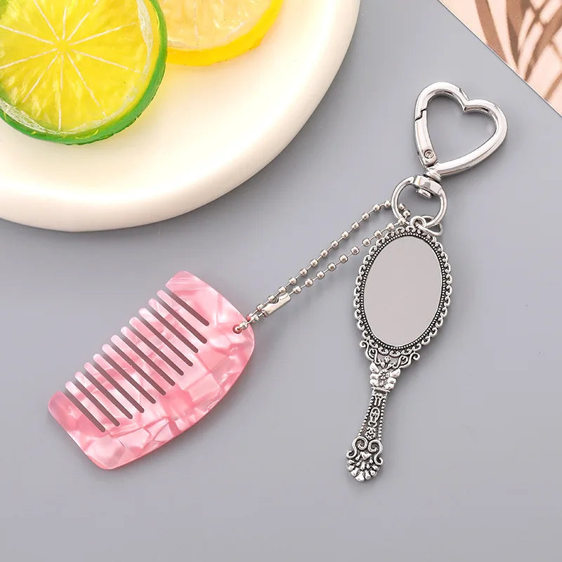 Zonyin Wholesale Mini Handle Handheld Makeup Mirror Keychain with Pendant Comb Mobile Phone Hanging Bag Decorative Accessories