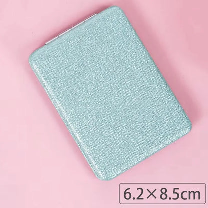 Zonyin Cute Portable Round PU Leather Folding Mirror Shiny Heart Shape 2X Double Sided Pu Pocket Makeup Mirror with Custom Logo