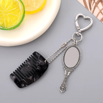 Zonyin Wholesale Mini Handle Handheld Makeup Mirror Keychain with Pendant Comb Mobile Phone Hanging Bag Decorative Accessories