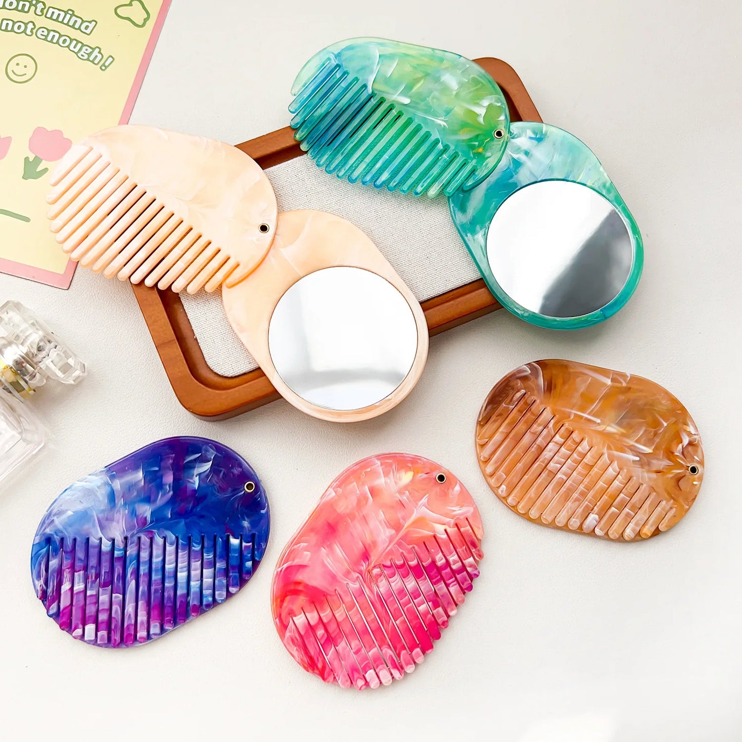 Zonyin Portable Oval Marble Makeup Mirror with Comb Foldable Rotating Cosmetic Pocket Mirror Hairbrush Combo Travel Mini Purse