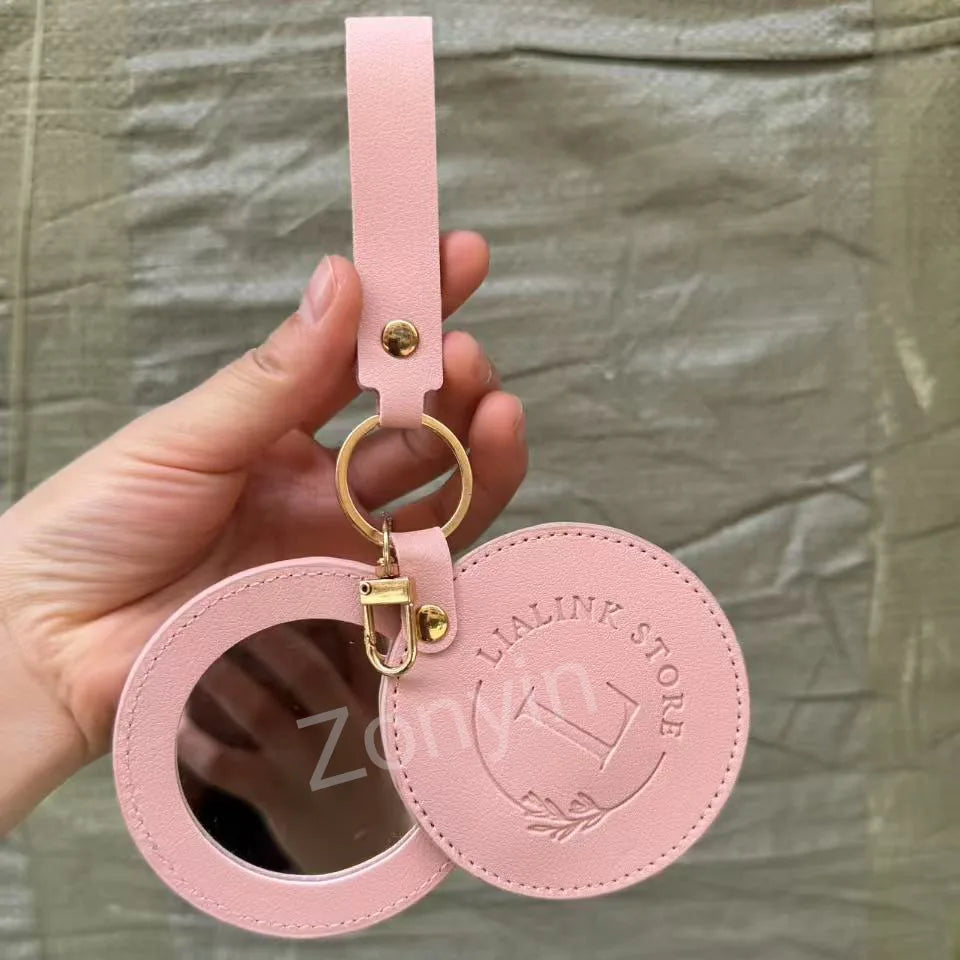 Zonyin LOW MOQ Customized Logo Round Pocket Cosmetic Mirror Pu Leather Portable Small Compact Makeup Mirror with Keychain