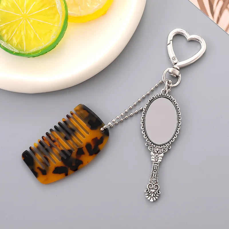 Zonyin Wholesale Mini Handle Handheld Makeup Mirror Keychain with Pendant Comb Mobile Phone Hanging Bag Decorative Accessories