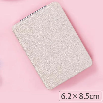 Zonyin Cute Portable Round PU Leather Folding Mirror Shiny Heart Shape 2X Double Sided Pu Pocket Makeup Mirror with Custom Logo